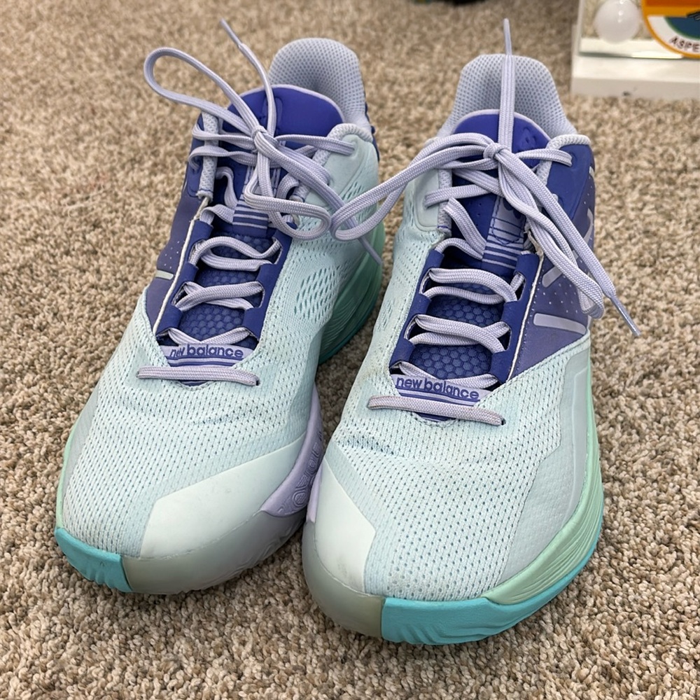 New balence purple, green, and blue basketball shoes